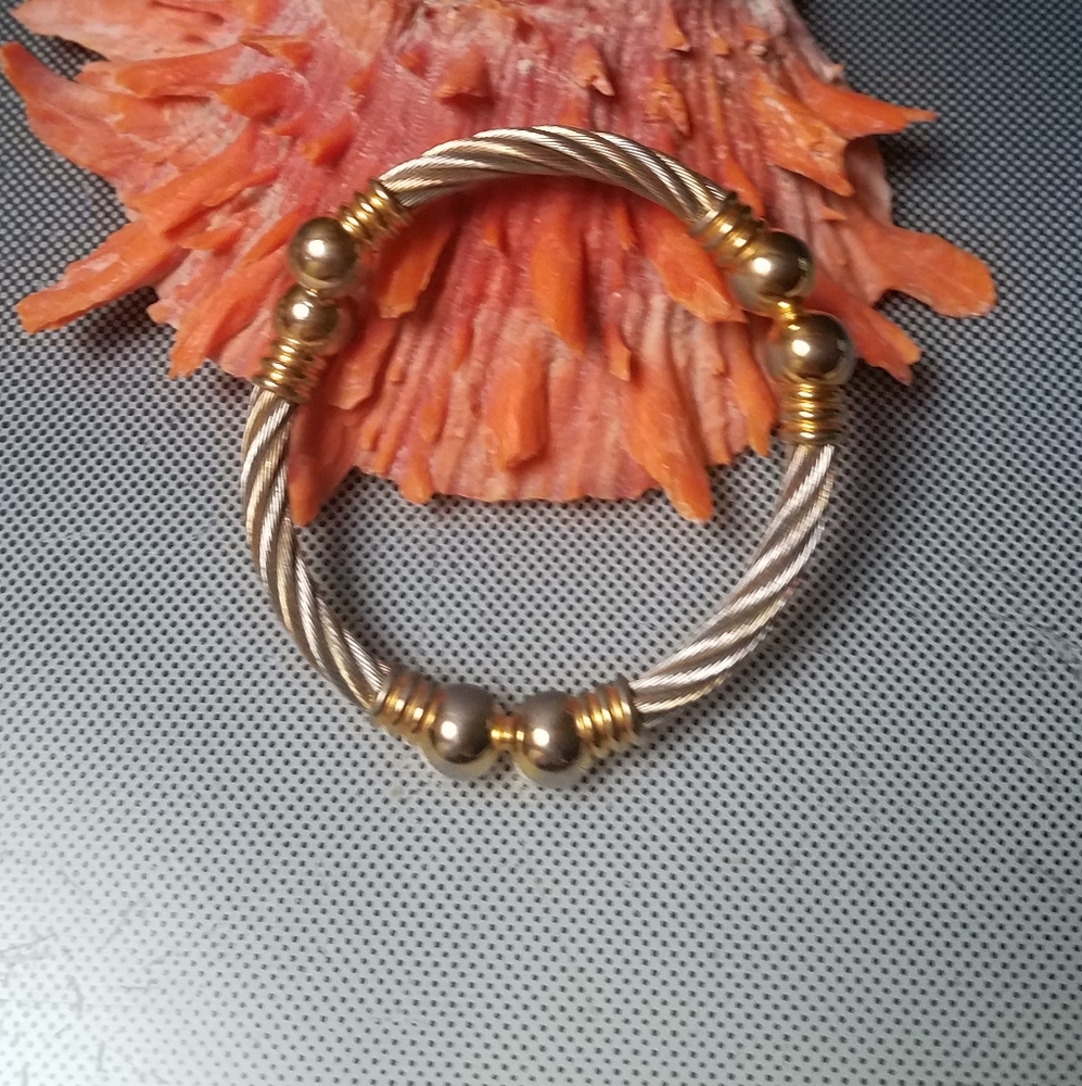 Cable wrap bracelet in silver and gold accents